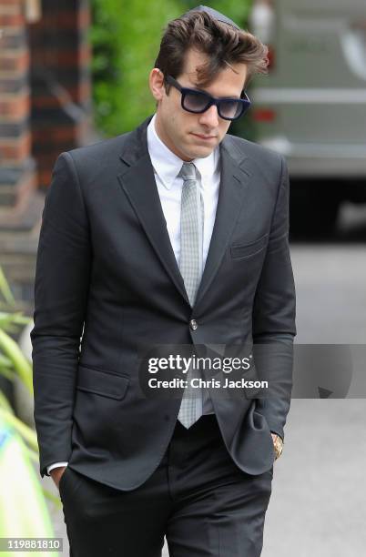 Mark Ronson leaves the cremation of Amy Winehouse at Golders Green Crematorium on July 26, 2011 in London, England. Winehouse was found dead in her...