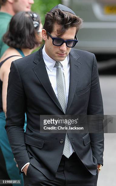 Mark Ronson leaves the cremation of Amy Winehouse at Golders Green Crematorium on July 26, 2011 in London, England. Winehouse was found dead in her...