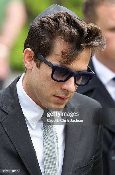 Mark Ronson leaves the cremation of Amy Winehouse at Golders Green Crematorium on July 26, 2011 in London, England. Winehouse was found dead in her...