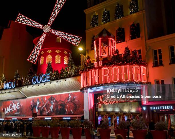Moulin Rouge on December 30, 2019 in Paris, France. Moulin Rouge is a cabaret in Paris. The original house, which burned down in 1915, was co-founded...