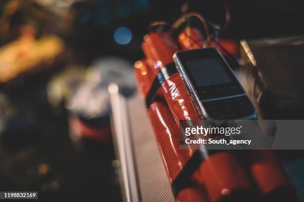 dynamite bomb with mobile phone attached to it - terrorism stock pictures, royalty-free photos & images