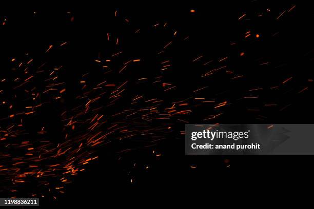 firework spark in high speed with black background - 火災 ストックフォトと画像