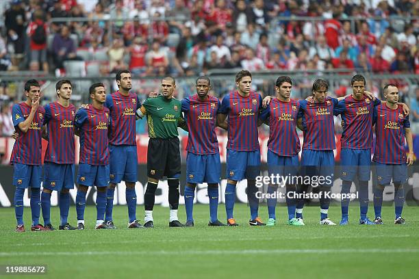 Barlcelona holds a minute's silence prior to the Audi Cup match between FC Barcelona and International de Porto Alegre at Allianz Arena on July 26,...