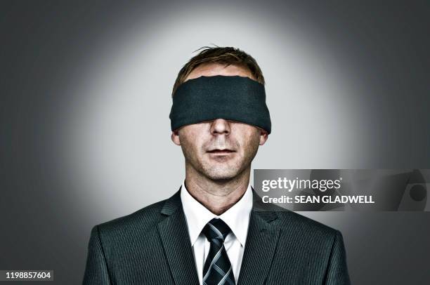 blindfolded man - mental illness stigma stock pictures, royalty-free photos & images