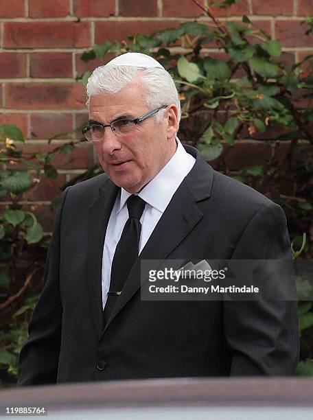 Mitch Winehouse attends a service for the cremation of his daughter Amy Winehouse at Golders Green Crematorium on July 26, 2011 in London, England.