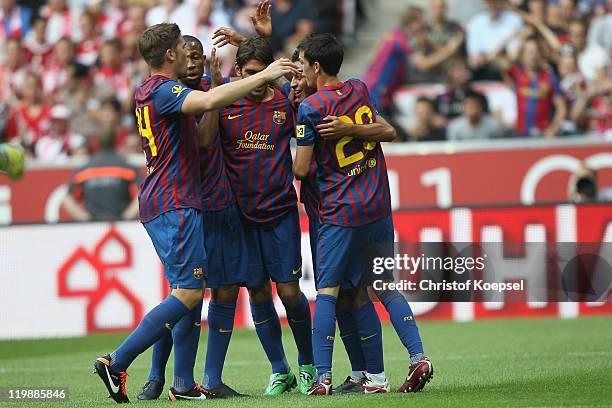 Alessandro Thiago of Barcelona celebrates the first goal wiht his team during the Audi Cup match between FC Barcelona and International de Porto...