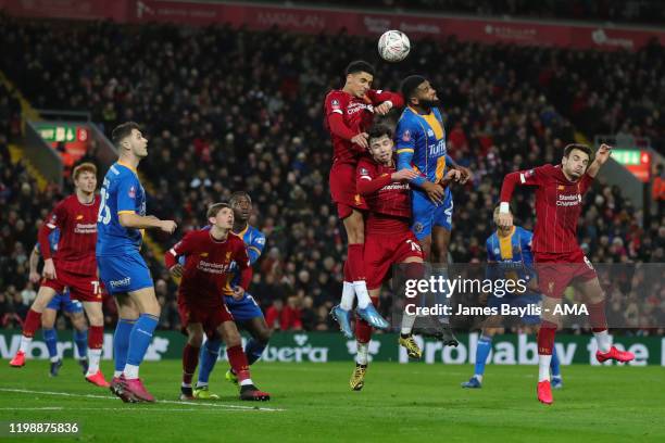 Ethan Ebanks-Landell of Shrewsbury Town competes with Ki-Jana Hoever and Neco Williams of Liverpool during the FA Cup Fourth Round Replay match...