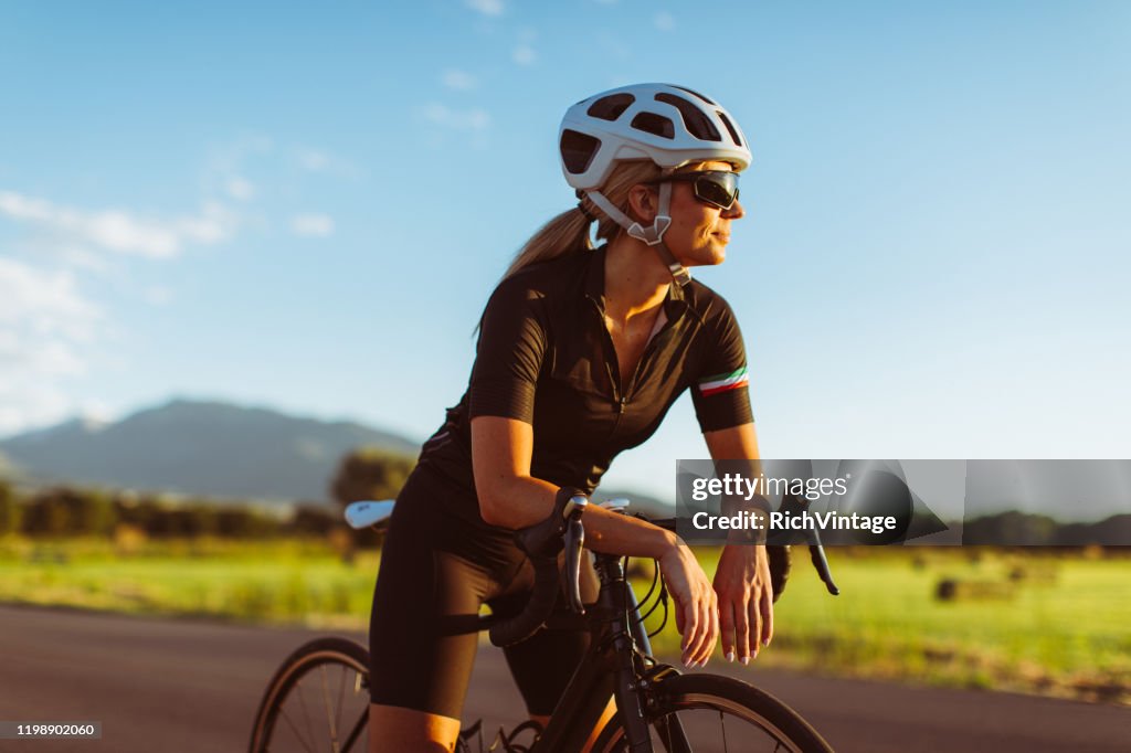 Female Riding Road Bike in Summer
