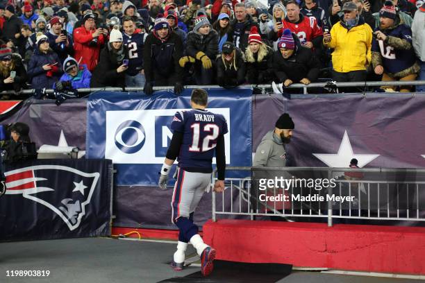 Tom Brady of the New England Patriots walks to the locker room during half time of the AFC Wild Card Playoff game at Gillette Stadium on January 04,...