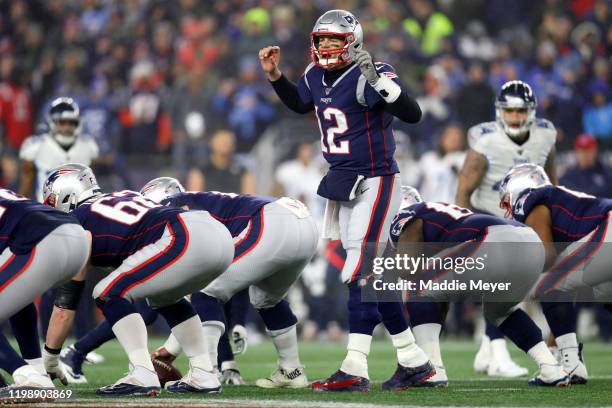 Tom Brady of the New England Patriots calls a play during the AFC Wild Card Playoff game against the Tennessee Titans at Gillette Stadium on January...