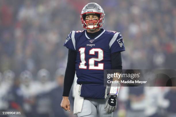 Tom Brady of the New England Patriots reacts during the the AFC Wild Card Playoff game against the Tennessee Titans at Gillette Stadium on January...