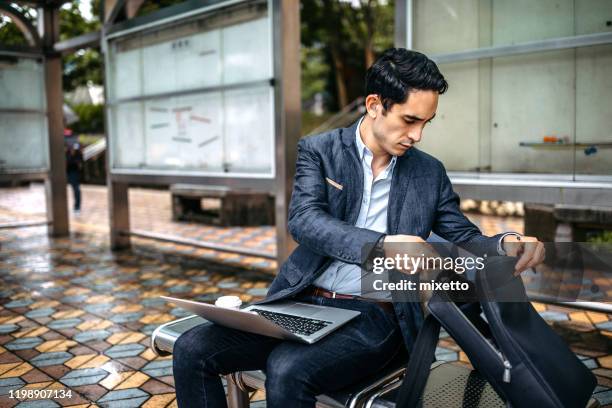 business man using laptop - hearing loss at work stock pictures, royalty-free photos & images