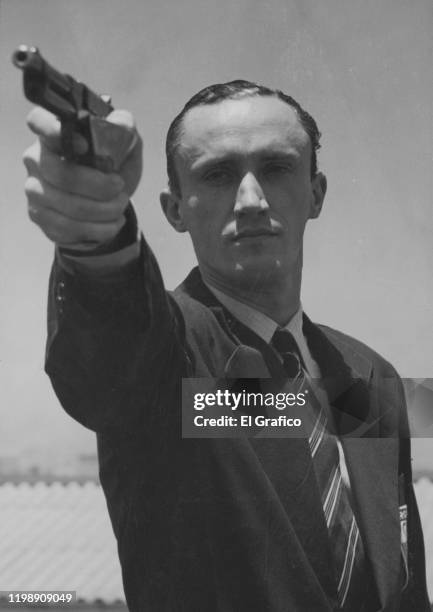 Silver medalist Carlos Enrique Díaz Sáenz Valiente of Argentina competes in the Men´s 25m rapid fire pistol event as part of the 1948 Olympic Games...