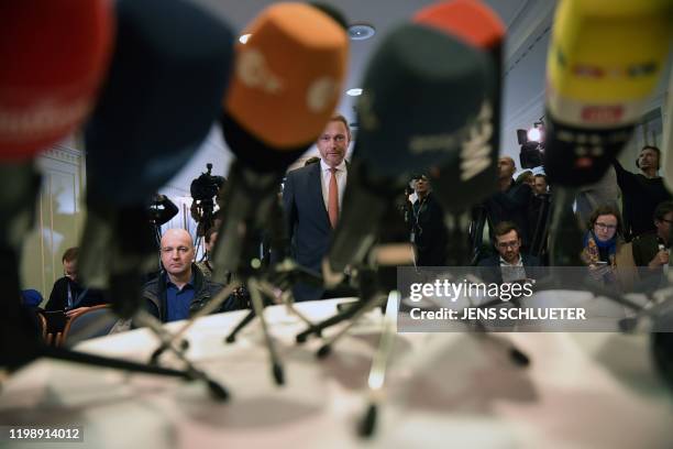 The leader of the Free Democratic Party Christian Lindner arrives for a press conference in a hotel in Erfurt, eastern Germany, shortly after the...