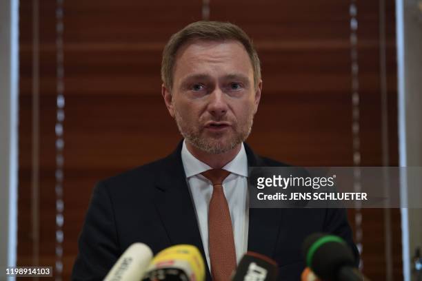 The leader of the Free Democratic Party Christian Lindner addresses a press conference in a hotel in Erfurt, eastern Germany, shortly after the newly...