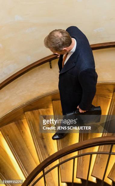 The leader of the Free Democratic Party Christian Lindner leaves after a press conference at a hotel in Erfurt, eastern Germany, shortly after the...
