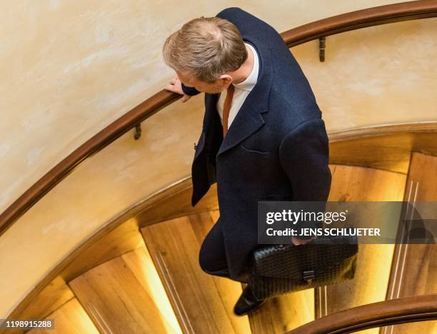 The leader of the Free Democratic Party Christian Lindner leaves after a press conference at a hotel in Erfurt, eastern Germany, shortly after the...