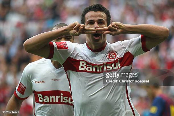 Leandro Damiao of Porto Alegre celebrates the second goal during the Audi Cup match between FC Barcelona and International de Porto Alegre at Allianz...
