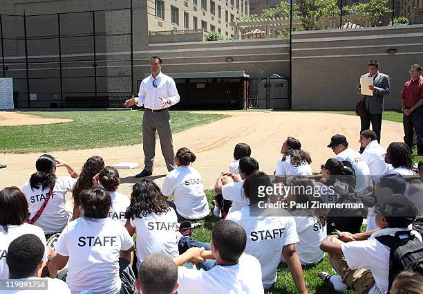 Mark Teixeira attends the announcement of Walmart's donation to the Harlem RBI Youth Employment Program and DREAM Charter School at the Field of...