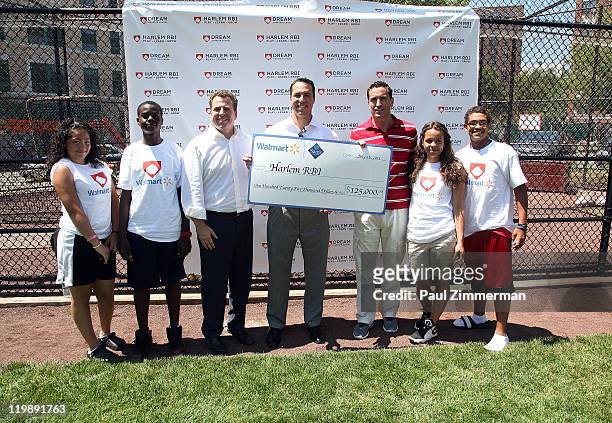Rich Berlin, Mark Teixeira and Philipe Serghini attend the announcement of Walmart's donation to the Harlem RBI Youth Employment Program and DREAM...