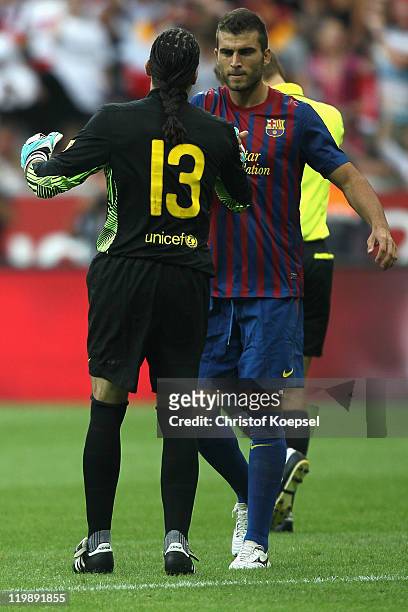 Deciding penalty-scorer Armando Lozano and goalkeeper Jose Manuel Pinto of Barcelona celebrate after the penalty shoot out at the close of the Audi...