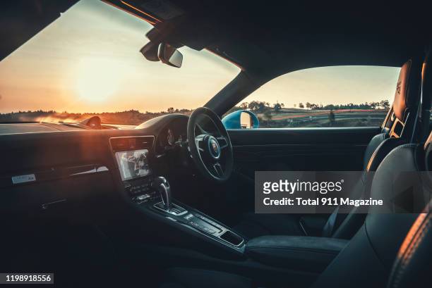 Interior view of 2018 Porsche 991 GT2 RS sports car, photographed during sunrise at the Circuit de Charade race track near Clermont-Ferrand in...