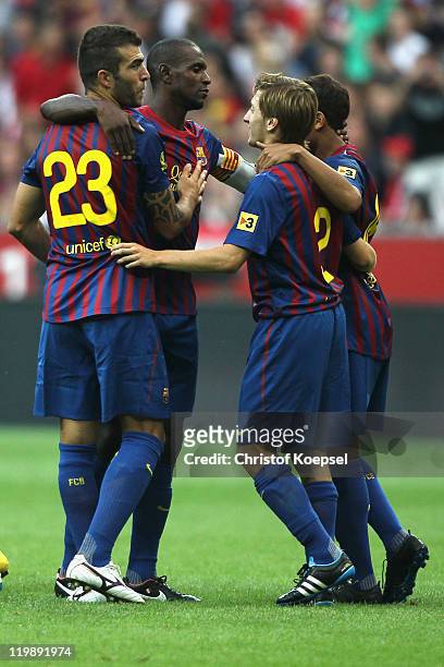 Armando Lozano of Barcelona celebrates with team-mates after scoring the 4-2 decision penalty during the Audi Cup match between FC Barcelona and...