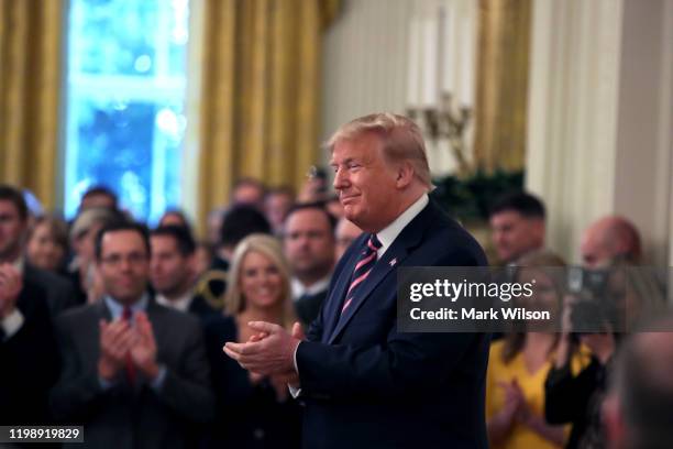 President Donald Trump arrives to speak to the media, one day after the U.S. Senate acquitted on two articles of impeachment, in the East Room of the...