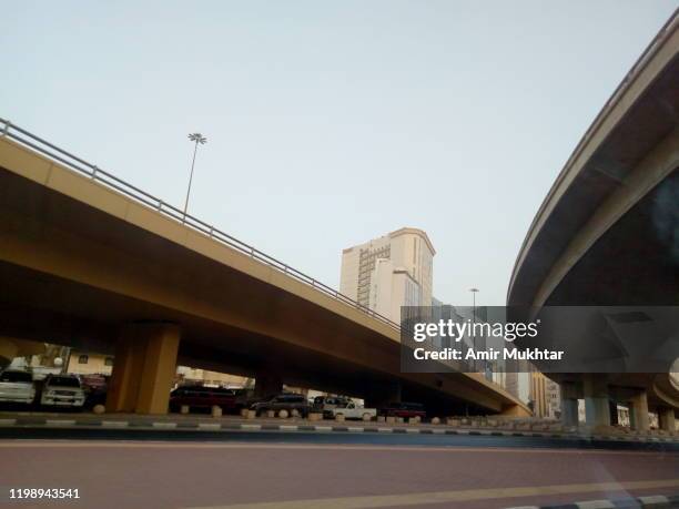 bridges and modern buildings in the city - saudi bridge stock pictures, royalty-free photos & images