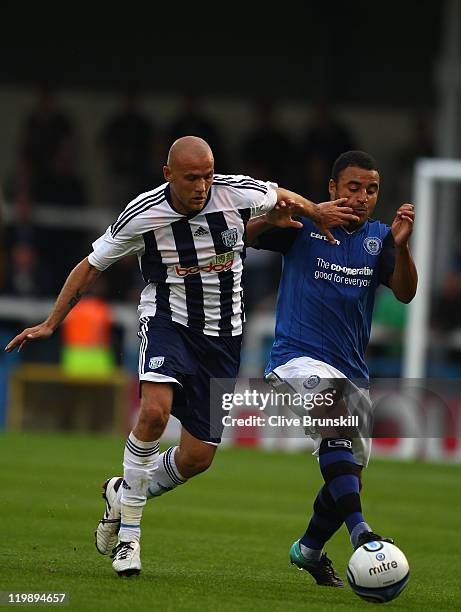 Roman Bednar of West Bromwich Albion in action with Marcus Holness of Rochdale during the pre season friendly match between Rochdale and West...