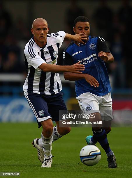 Roman Bednar of West Bromwich Albion in action with Marcus Holness of Rochdale during the pre season friendly match between Rochdale and West...