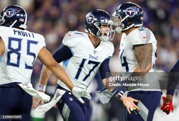 Ryan Tannehill of the Tennessee Titans celebrates after rushing for a 1-yard touchdown during the third quarter against the Baltimore Ravens in the...