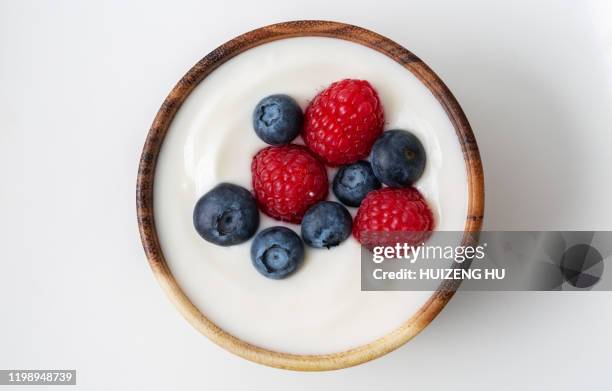 top view of yogurt with raspberry and blueberry - berry stock pictures, royalty-free photos & images