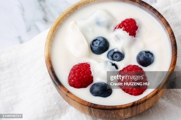 yogurt with raspberry and blueberry - antioxidant cream stock pictures, royalty-free photos & images