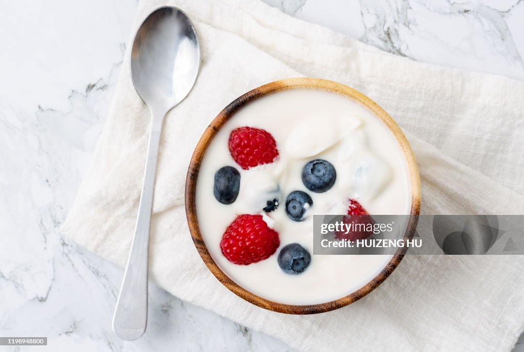 Yogurt with raspberry and blueberry, top view
