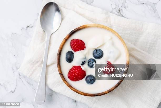 yogurt with raspberry and blueberry, top view - strawberry and cream stock pictures, royalty-free photos & images