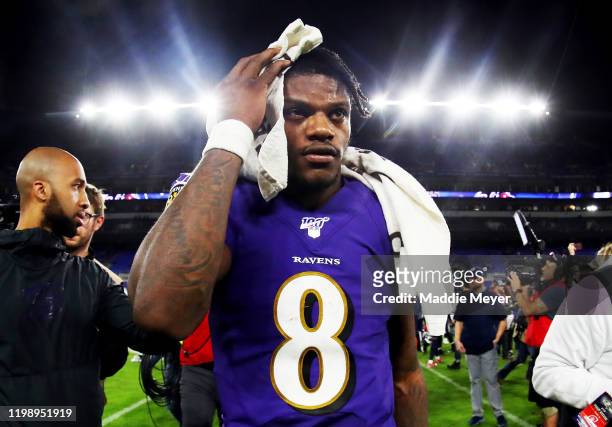 Lamar Jackson of the Baltimore Ravens walks off the field after being defeated by the Tennessee Titans in the AFC Divisional Playoff game 28-12 at...