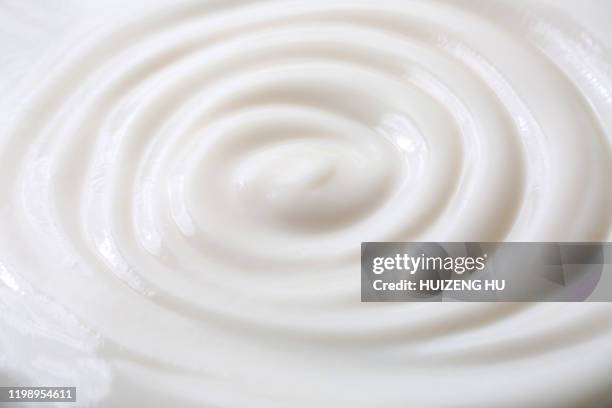 milky cream, yogurt swirl surface, backgrounds - food white background foto e immagini stock