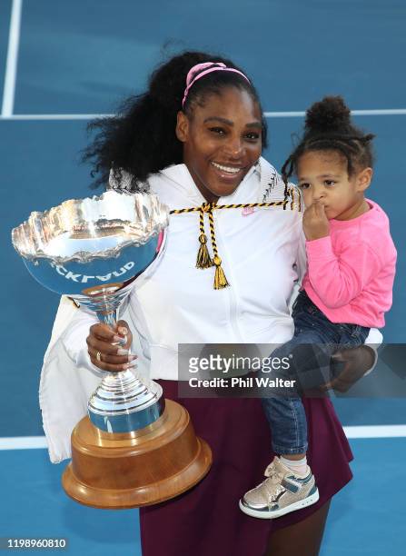 Serena Williams of the USA holds her daughter Alexis Olympia with the trophy following the Women's Final between Serena Williams and Jessica Pegula...
