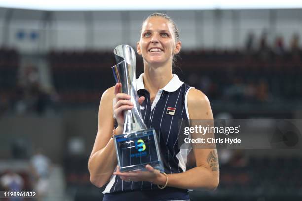 Karolina Pliskova of The Czech Republic holds the winners trophy after the finals match against Madison Keys of the USA during day seven of the 2020...