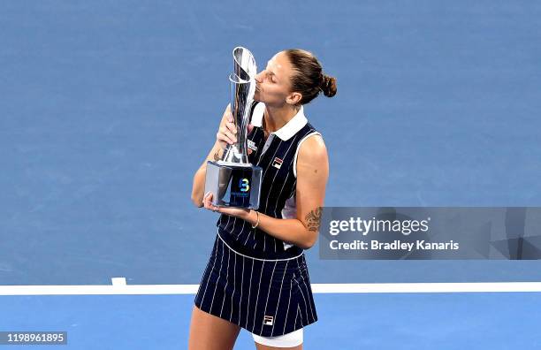 Karolina Pliskova of The Czech Republic celebrates victory as she kisses the winners trophy after the finals match against Madison Keys of the USA...