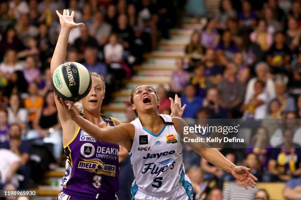 Leilani Mitchell of the Flyers drives to the basket under pressure from Sophie Cunningham of the Boomers during the round 13 WNBL match between the...