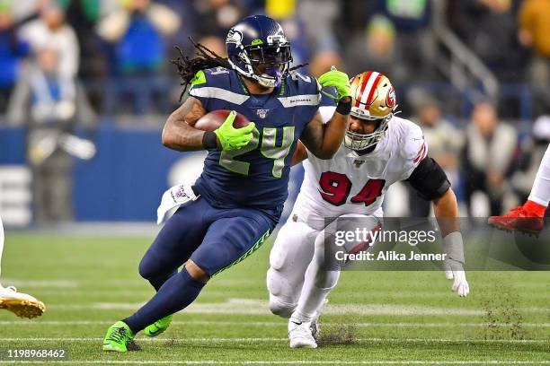 Marshawn Lynch of the Seattle Seahawks runs the ball during the third quarter of the game against the San Francisco 49ers at CenturyLink Field on...