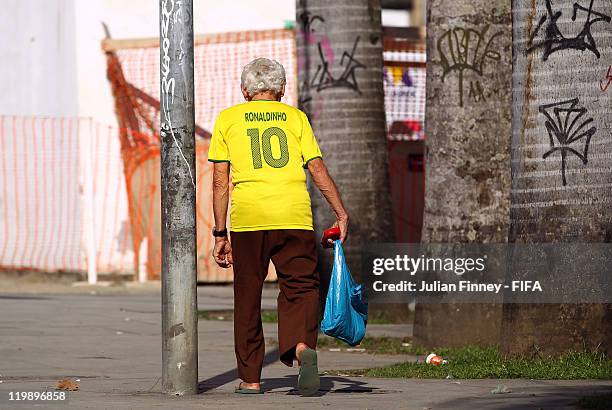 Man wearing a Ronaldinho shirt is seen in central Rio prior to the Preliminary Draw of the 2014 FIFA World Cup on July 26, 2011 in Rio de Janeiro,...