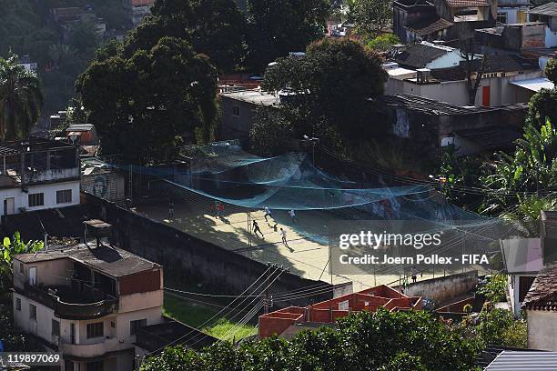 Kids playing football in a favela prior to the Preliminary Draw of the 2014 FIFA World Cup on July 26, 2011 in Rio de Janeiro, Brazil.