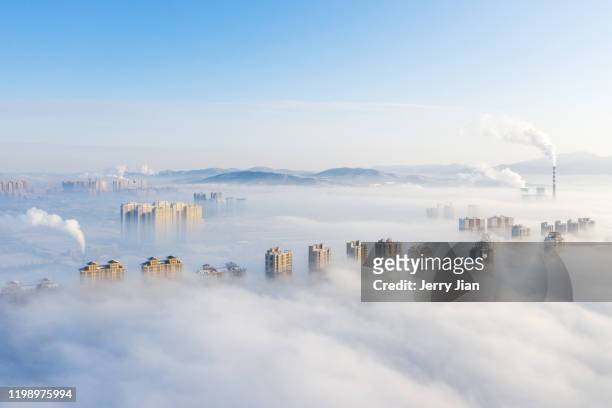 aerial view of jilin city in winter of fog - jilin stockfoto's en -beelden