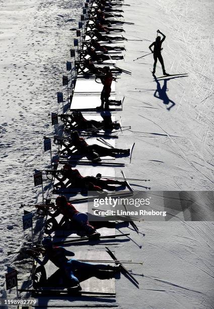 Athletes are seen at the shooting range during the Single Mixed Relay in Biathlon during day 3 of the Lausanne 2020 Winter Youth Olympics at Stade...