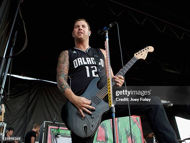 Guitarist Kevin Skaff of A Day to Remember performs onstage during the 2011 Vans Warped Tour at the Marcus Amphitheater on July 19, 2011 in...