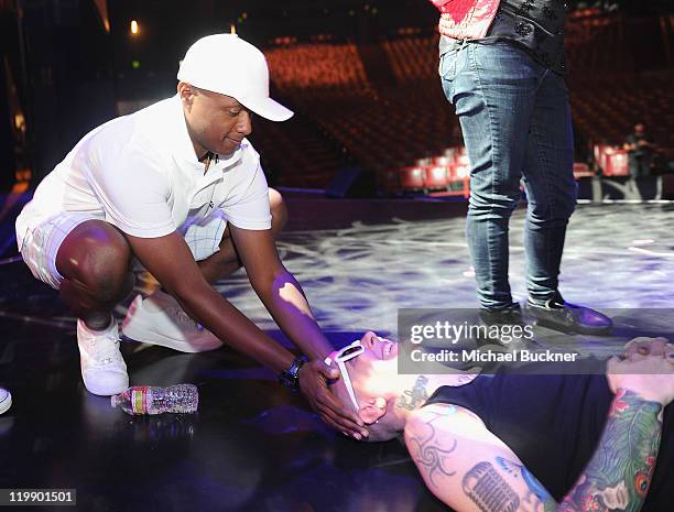 Singer Javier Colon and Beverly McClellan rehearse on stage for "The Voice" Live Tour at the Gibson Amphitheatre on July 26, 2011 in Universal City,...