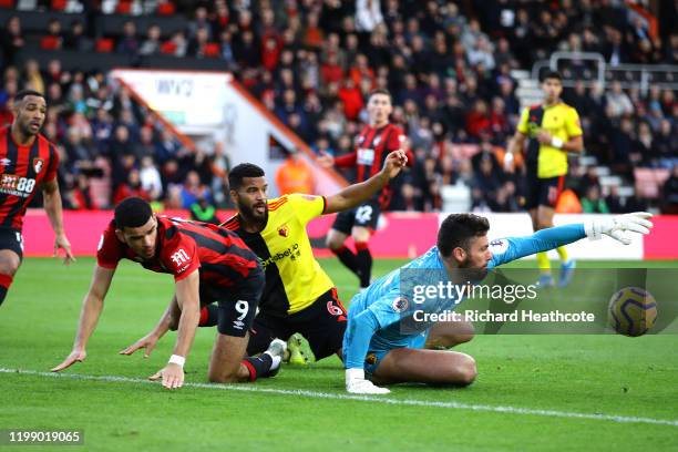 Ben Foster of Watford and Adrian Mariappa of Watford clash with Dominic Solanke of AFC Bournemouth during the Premier League match between AFC...